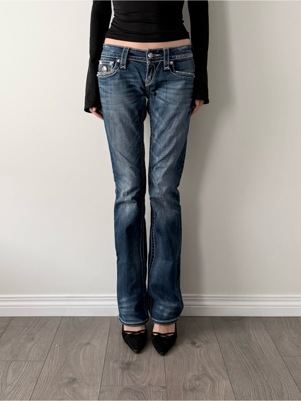 Vintage rock revival medium wash low rise bootcut jeans.